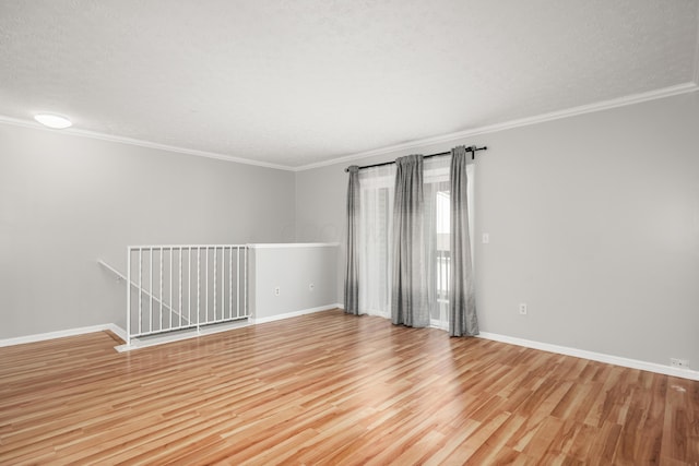 5373 Cypress Chase, Columbus, OH 43228 - empty room with ornamental molding, light wood-style floors, baseboards, and a textured ceiling