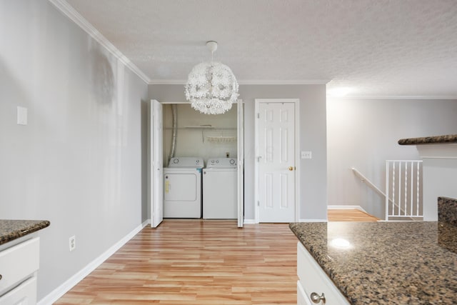 5373 Cypress Chase, Columbus, OH 43228 - washroom featuring independent washer and dryer, light wood finished floors, ornamental molding, a chandelier, and a textured ceiling