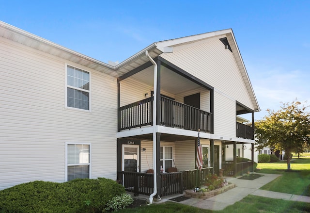 5373 Cypress Chase, Columbus, OH 43228 - view of side of home with a balcony, a porch, and a yard