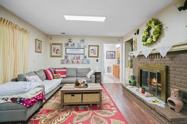 1235 Canteberry Ln, Mansfield, OH 44906 - living area featuring wood finished floors and a brick fireplace