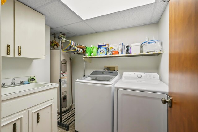 1235 Canteberry Ln, Mansfield, OH 44906 - laundry area featuring water heater, washing machine and clothes dryer, and cabinet space