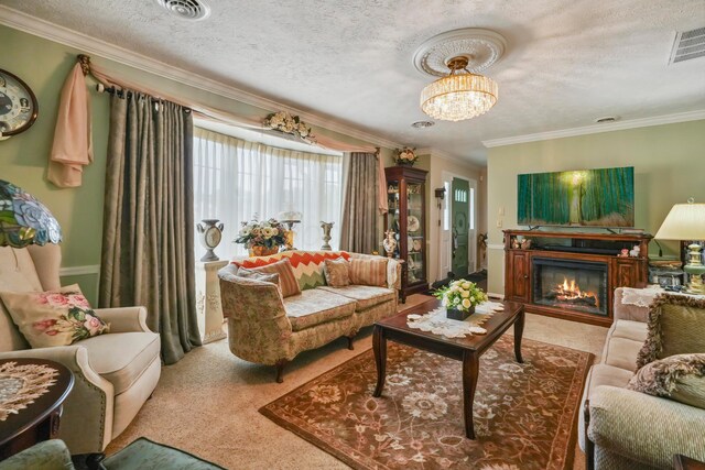 1235 Canteberry Ln, Mansfield, OH 44906 - carpeted living area featuring crown molding, a glass covered fireplace, a chandelier, and a textured ceiling
