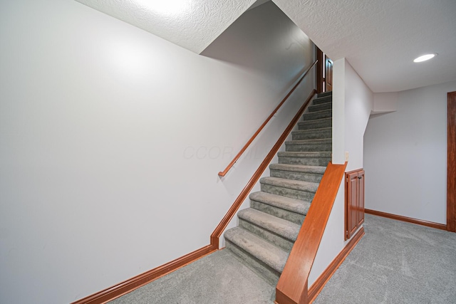 390 Engelwood Ct, Powell, OH 43065 - staircase with carpet and a textured ceiling