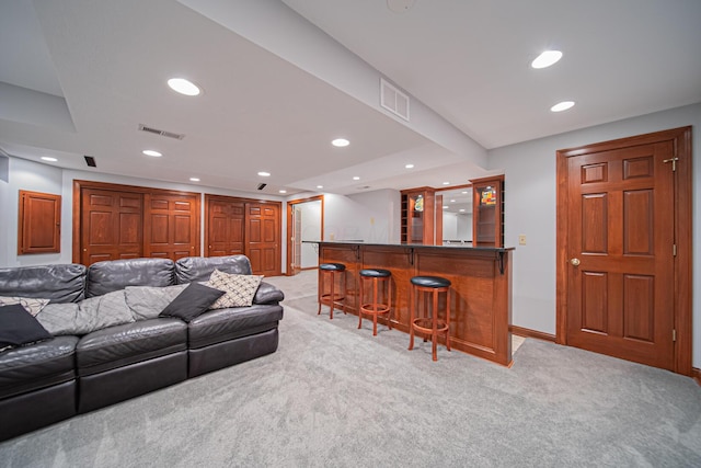 390 Engelwood Ct, Powell, OH 43065 - living room with bar, light colored carpet, and recessed lighting