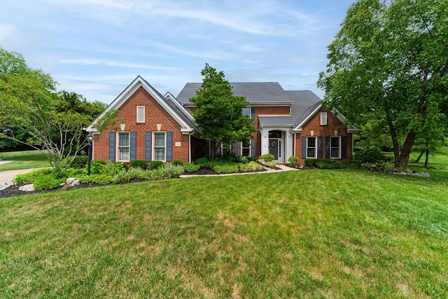 390 Engelwood Ct, Powell, OH 43065 - view of front of home with brick siding and a front yard