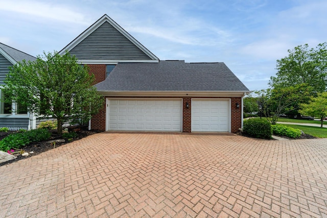 390 Engelwood Ct, Powell, OH 43065 - garage featuring decorative driveway