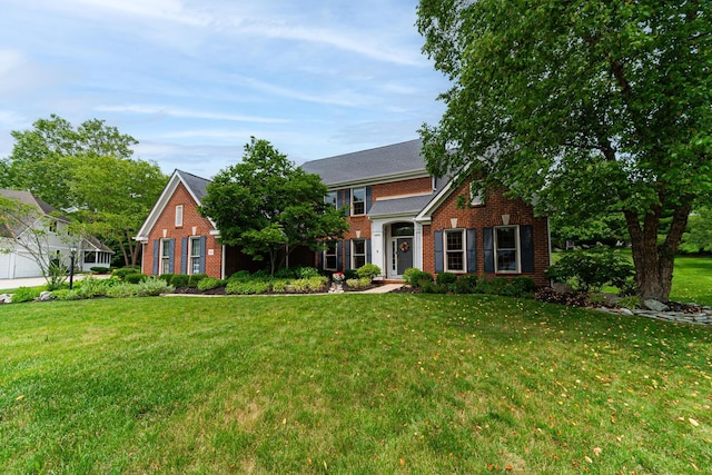 390 Engelwood Ct, Powell, OH 43065 - view of front facade featuring brick siding and a front yard