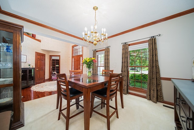 390 Engelwood Ct, Powell, OH 43065 - dining room featuring a chandelier, ornamental molding, and light carpet