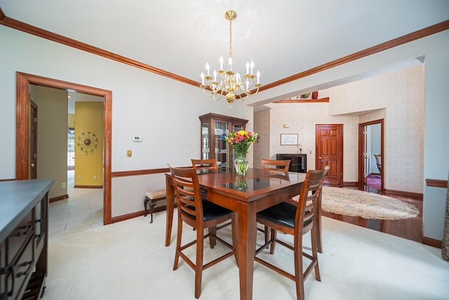 390 Engelwood Ct, Powell, OH 43065 - dining space with a chandelier, ornamental molding, healthy amount of natural light, and light carpet