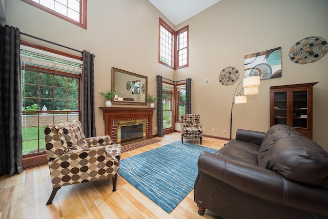390 Engelwood Ct, Powell, OH 43065 - living room featuring high vaulted ceiling, light wood-style floors, and a fireplace