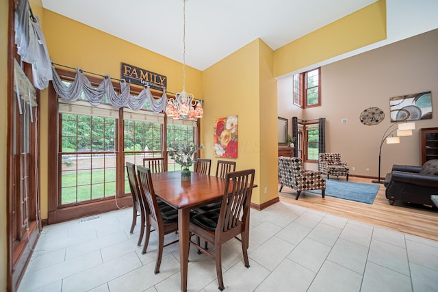 390 Engelwood Ct, Powell, OH 43065 - dining room featuring light tile patterned floors and a towering ceiling