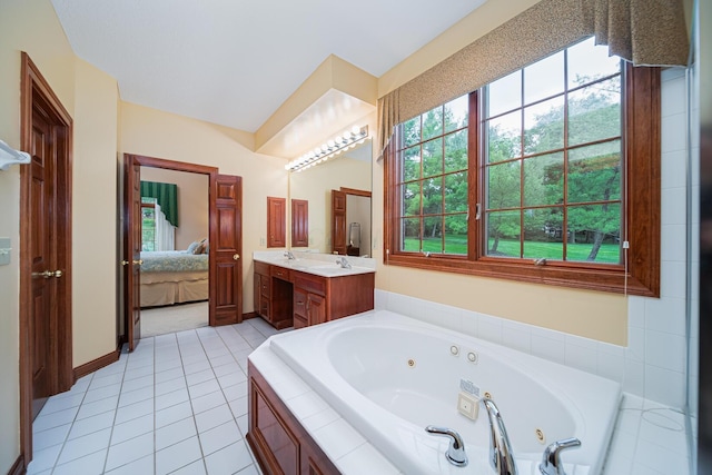 390 Engelwood Ct, Powell, OH 43065 - ensuite bathroom featuring a tub with jets, double vanity, and tile patterned floors