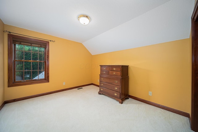 390 Engelwood Ct, Powell, OH 43065 - additional living space with light colored carpet and lofted ceiling