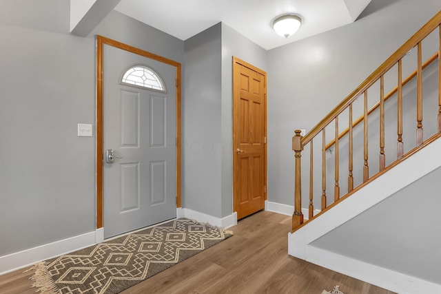 1200 Chanteloup Dr, Marion, OH 43302 - foyer entrance with stairs, wood finished floors, and baseboards