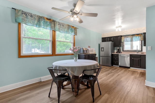 1200 Chanteloup Dr, Marion, OH 43302 - dining area featuring light wood-type flooring, a ceiling fan, and baseboards