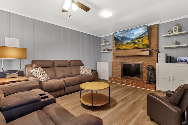 1200 Chanteloup Dr, Marion, OH 43302 - living room featuring light wood-type flooring, ceiling fan, a fireplace, and crown molding