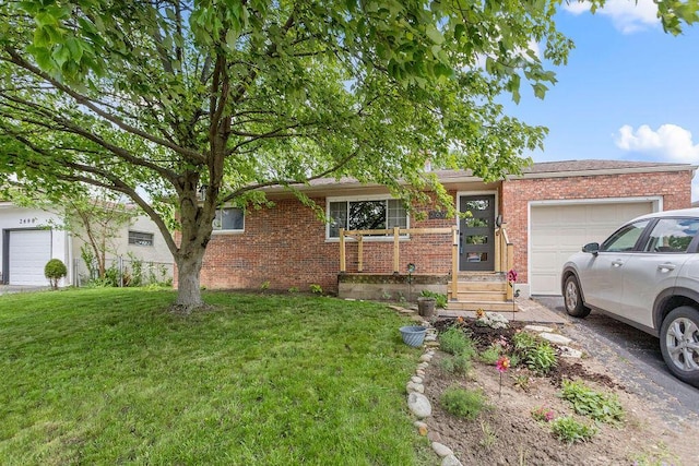 2690 Kingston Ave, Grove City, OH 43123 - ranch-style home featuring a garage, brick siding, and a front lawn