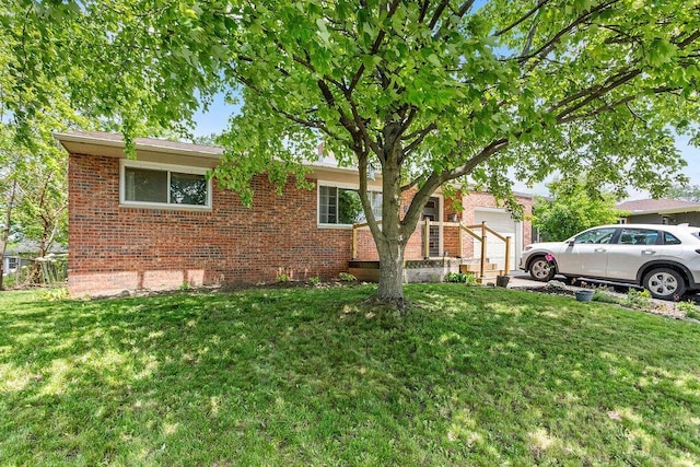 2690 Kingston Ave, Grove City, OH 43123 - view of front of house with brick siding, a garage, and a front yard
