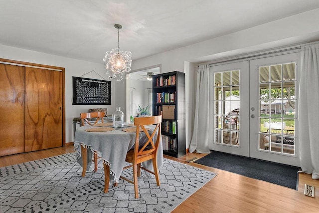 2690 Kingston Ave, Grove City, OH 43123 - dining area featuring a chandelier, french doors, wood finished floors, and a ceiling fan
