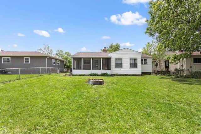 2690 Kingston Ave, Grove City, OH 43123 - rear view of house with a sunroom and a chimney