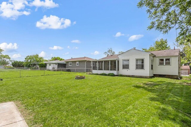 2690 Kingston Ave, Grove City, OH 43123 - back of property with a sunroom and a fire pit