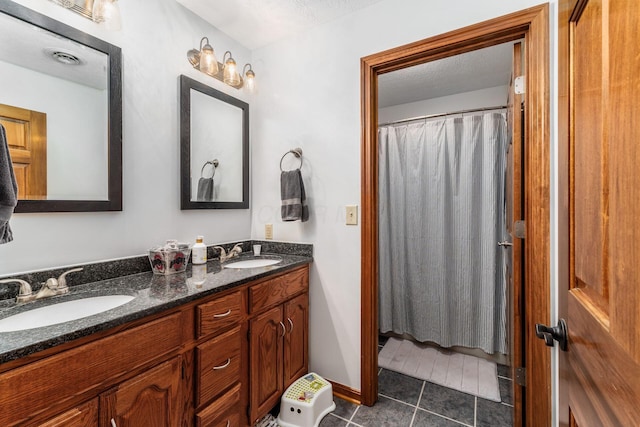 1861 Ginder Rd NW, Lancaster, OH 43130 - full bathroom with double vanity, tile patterned floors, and a textured ceiling