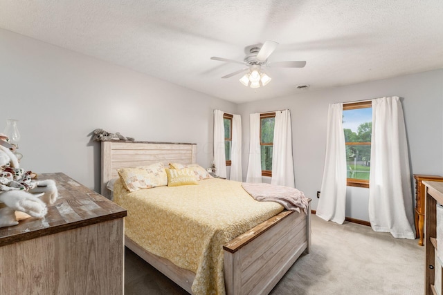 1861 Ginder Rd NW, Lancaster, OH 43130 - bedroom with light carpet, a ceiling fan, baseboards, and a textured ceiling