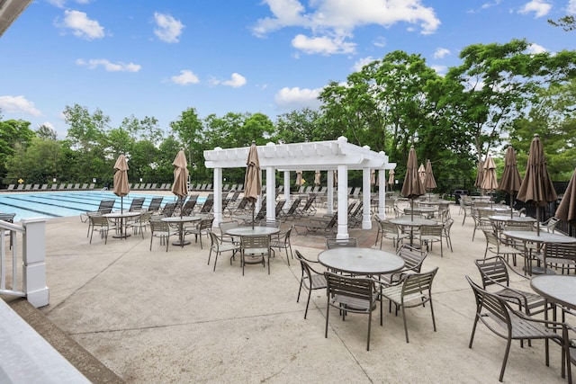2079 Tournament Way, Grove City, OH 43123 - view of patio featuring a pergola, a community pool, and view of wooded area