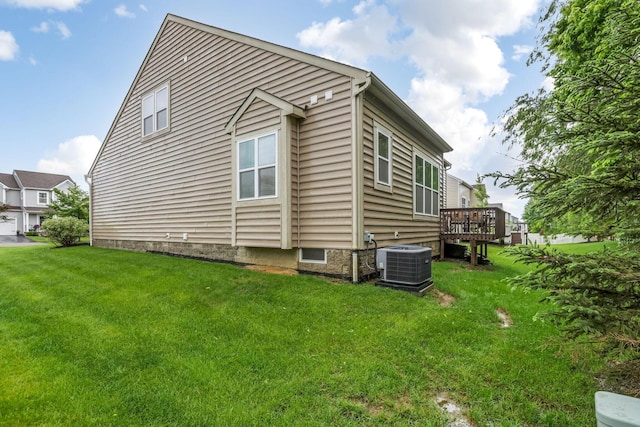 2079 Tournament Way, Grove City, OH 43123 - view of home's exterior with central air condition unit, a wooden deck, and a yard