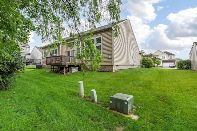 2079 Tournament Way, Grove City, OH 43123 - back of property with a wooden deck, a yard, and central air condition unit