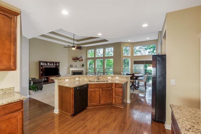 2079 Tournament Way, Grove City, OH 43123 - kitchen with dishwasher, a sink, freestanding refrigerator, ceiling fan, and dark wood-type flooring