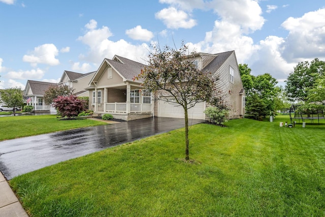 2079 Tournament Way, Grove City, OH 43123 - view of front of property featuring asphalt driveway, covered porch, and a front lawn