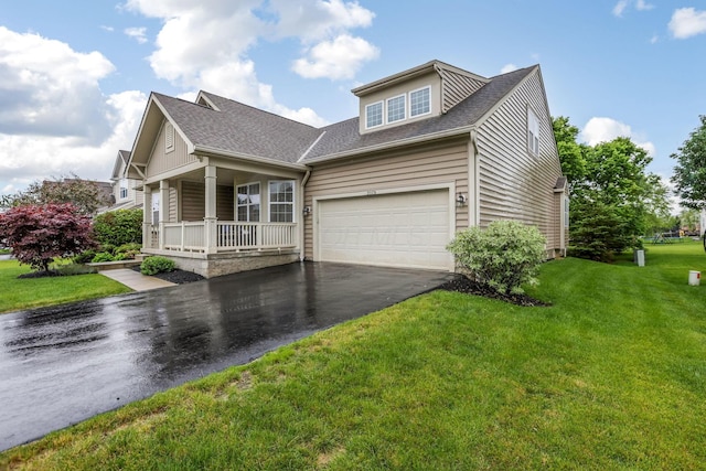 2079 Tournament Way, Grove City, OH 43123 - view of front of property featuring asphalt driveway, a porch, roof with shingles, and a front yard