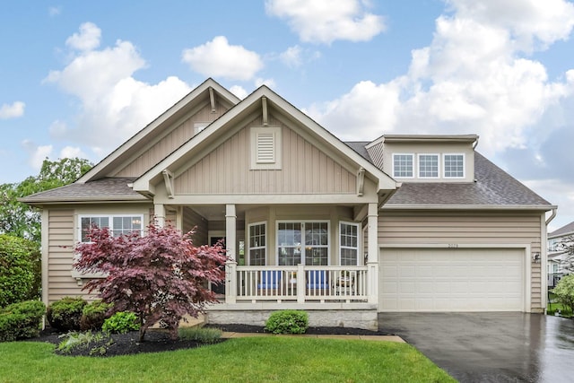 2079 Tournament Way, Grove City, OH 43123 - craftsman-style home with covered porch, driveway, roof with shingles, and board and batten siding