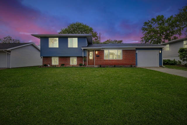 600 Kappler Rd, Heath, OH 43056 - tri-level home featuring a garage, concrete driveway, a front yard, and brick siding