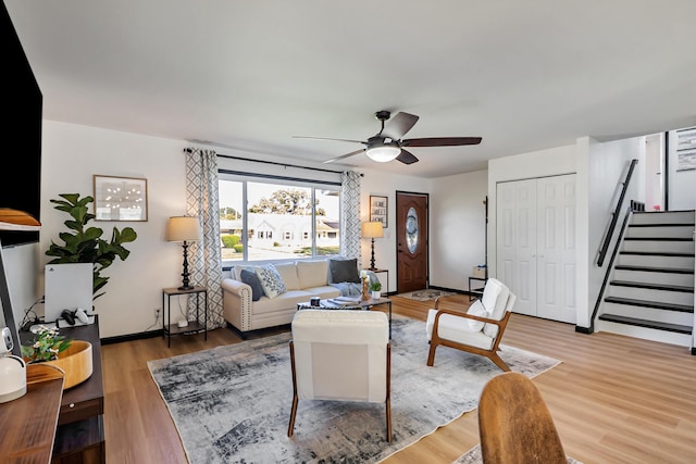 600 Kappler Rd, Heath, OH 43056 - living room with stairway, ceiling fan, light wood-style floors, and baseboards