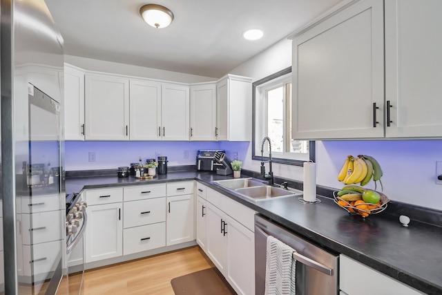 600 Kappler Rd, Heath, OH 43056 - kitchen featuring stainless steel appliances, a sink, dark countertops, and white cabinets