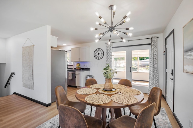 600 Kappler Rd, Heath, OH 43056 - dining room featuring light wood-type flooring, french doors, a chandelier, and healthy amount of natural light