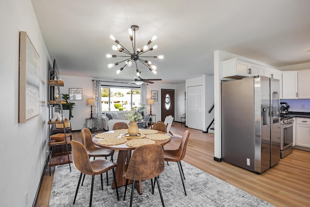 600 Kappler Rd, Heath, OH 43056 - dining room with light wood finished floors, a chandelier, and stairs