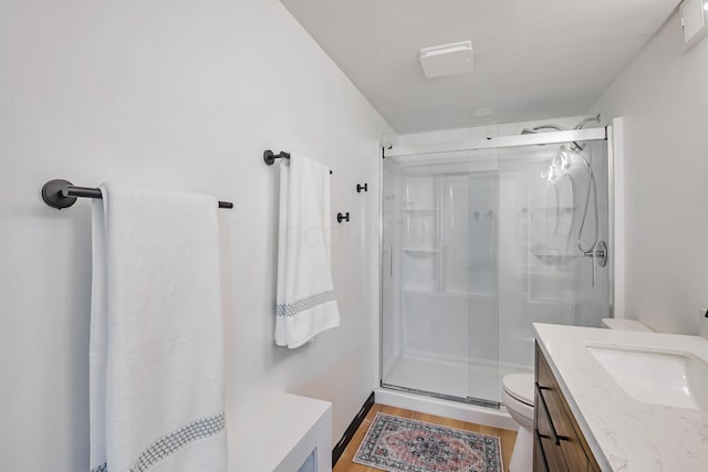 600 Kappler Rd, Heath, OH 43056 - bathroom with a shower stall, toilet, vanity, and wood finished floors
