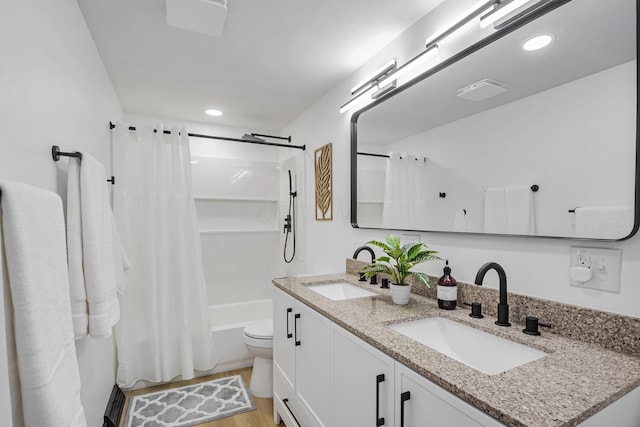600 Kappler Rd, Heath, OH 43056 - full bath with double vanity, shower / bathtub combination with curtain, wood finished floors, toilet, and recessed lighting