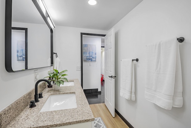 600 Kappler Rd, Heath, OH 43056 - bathroom with double vanity and wood finished floors