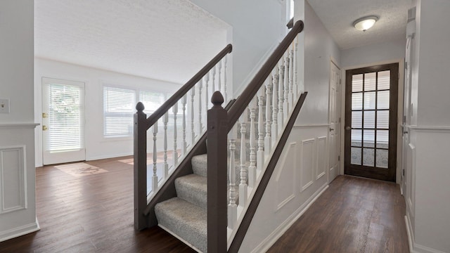 7406 Murrayfield Dr, Columbus, OH 43085 - staircase with a textured ceiling and wood finished floors