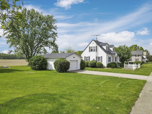 6880 Sandusky Ave, Chatfield, OH 44825 - view of home's exterior with concrete driveway, an outbuilding, a yard, and a garage