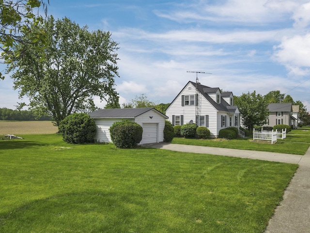 6880 Sandusky Ave, Chatfield, OH 44825 - view of property exterior featuring concrete driveway, an outdoor structure, a yard, and a garage
