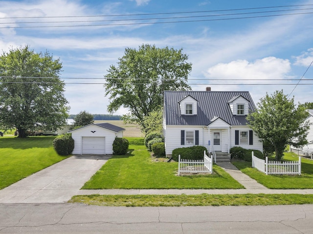 6880 Sandusky Ave, Chatfield, OH 44825 - cape cod home featuring an outdoor structure, metal roof, concrete driveway, a garage, and a chimney