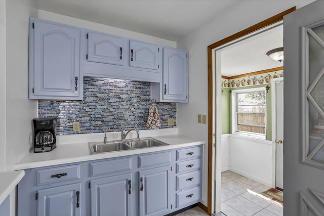 6880 Sandusky Ave, Chatfield, OH 44825 - kitchen featuring a sink, light countertops, decorative backsplash, and light tile patterned flooring