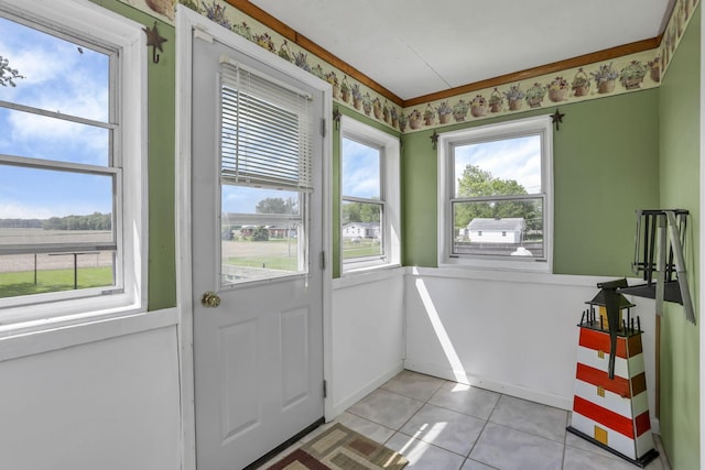 6880 Sandusky Ave, Chatfield, OH 44825 - doorway to outside featuring light tile patterned floors and baseboards