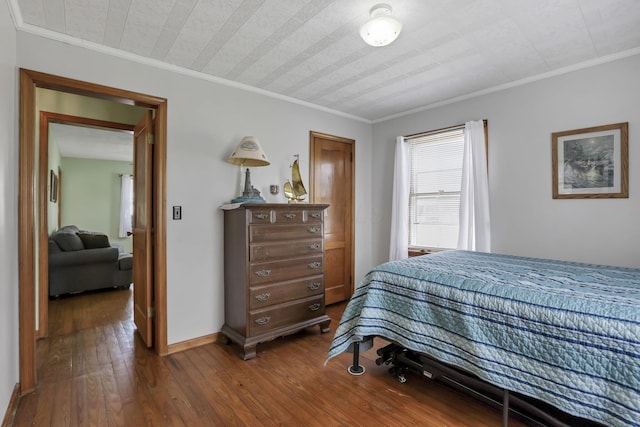 6880 Sandusky Ave, Chatfield, OH 44825 - bedroom with dark wood-style floors, crown molding, and baseboards