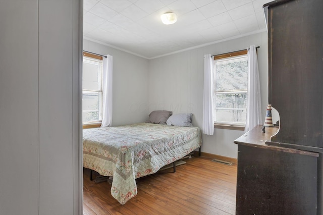 6880 Sandusky Ave, Chatfield, OH 44825 - bedroom featuring ornamental molding, wood finished floors, and baseboards